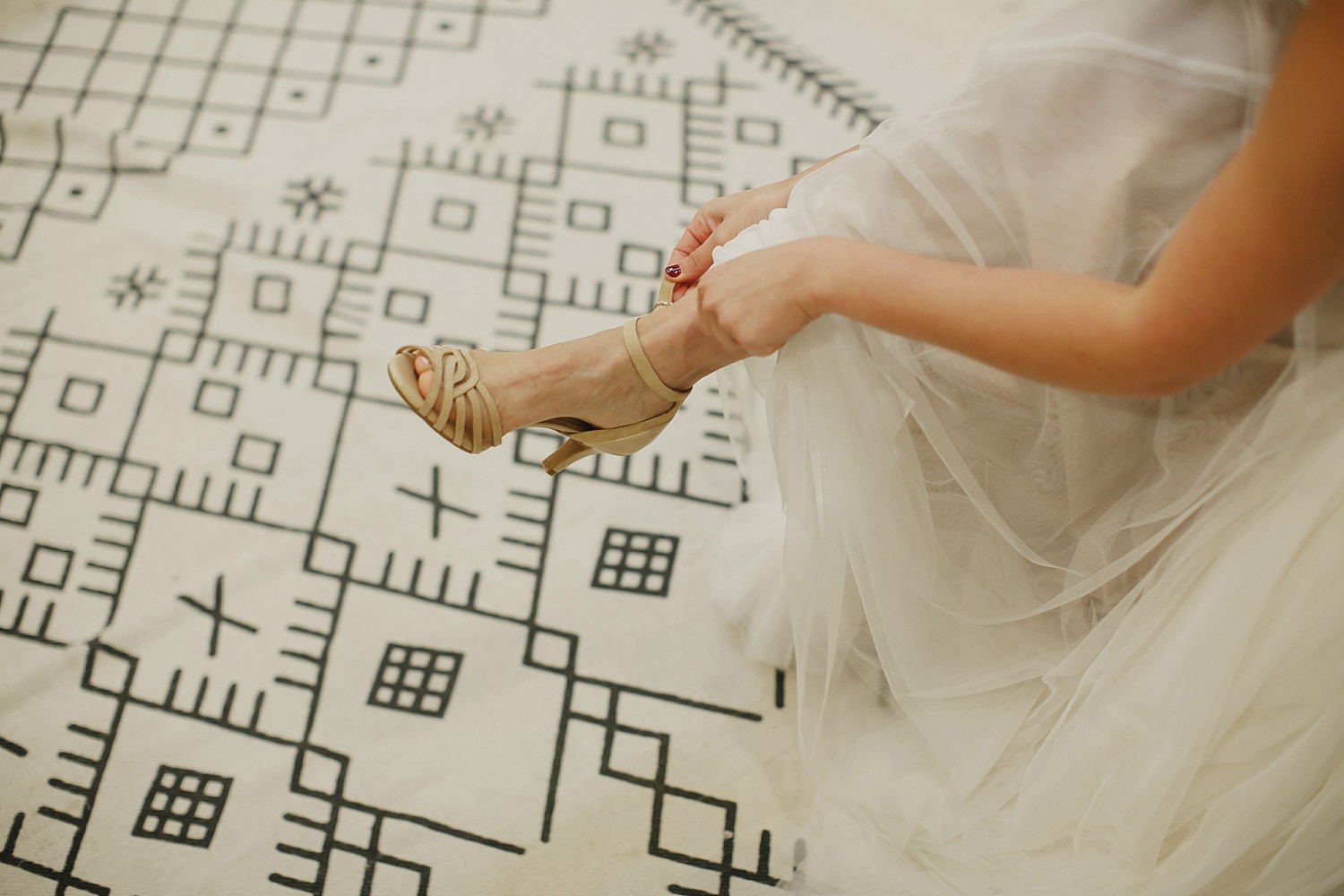 bride puts on shoes