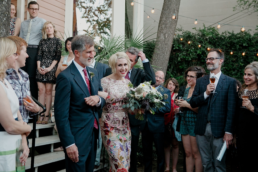 bride walking down isle at justine's secret house